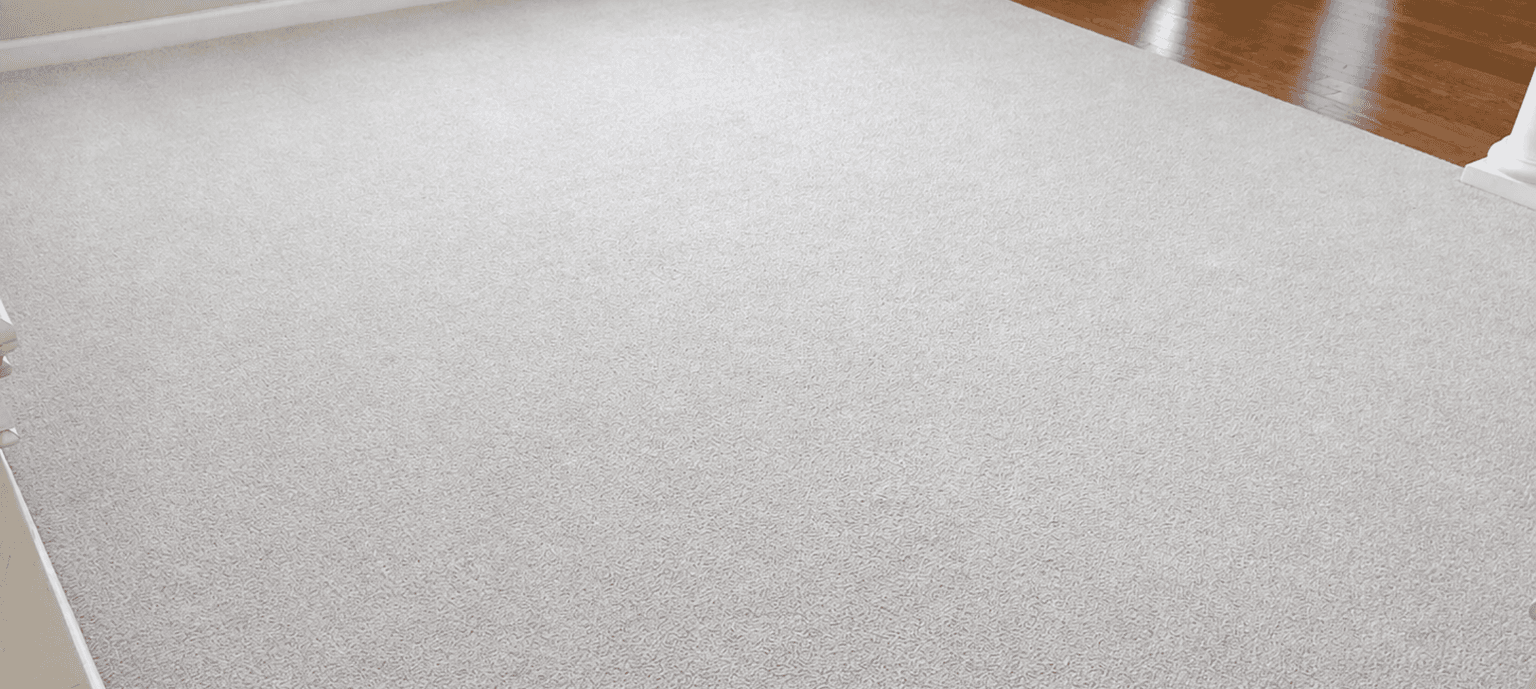 Light gray carpet next to hardwood after a Safe-Dry cleaning in a Gallatin, TN home